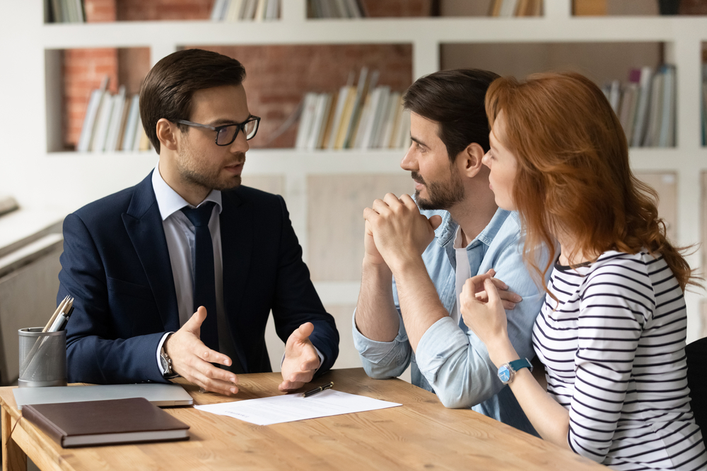 guy talking to two people at table
